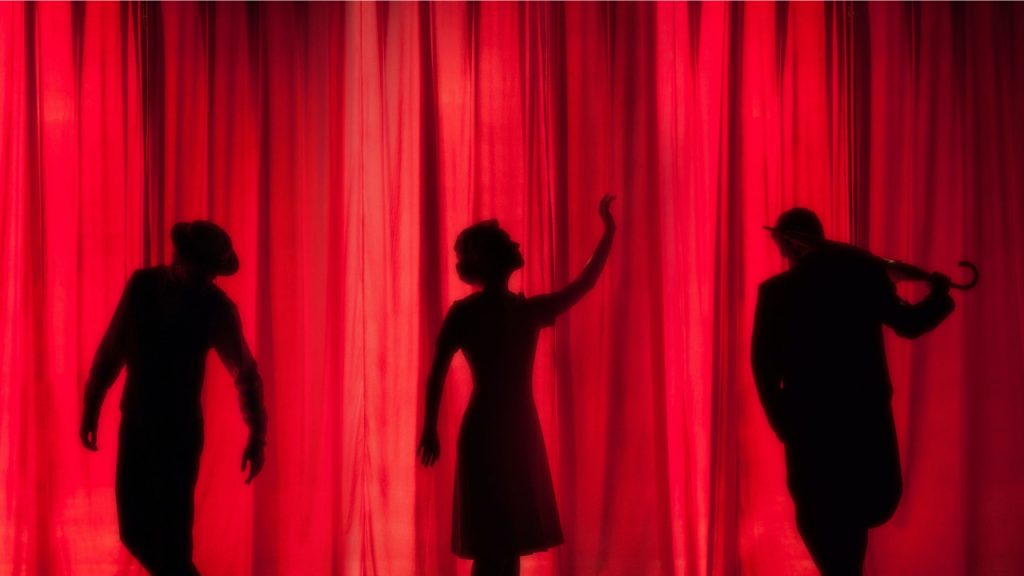 Human Shadows on Red Background. Theatre Scene.