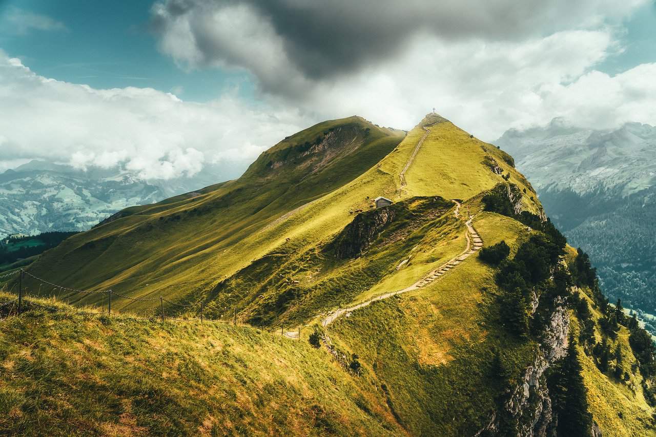 photo of a mountain summit in summer